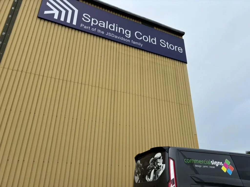 Spalding Cold Store building sign with a Commercial Signs van below