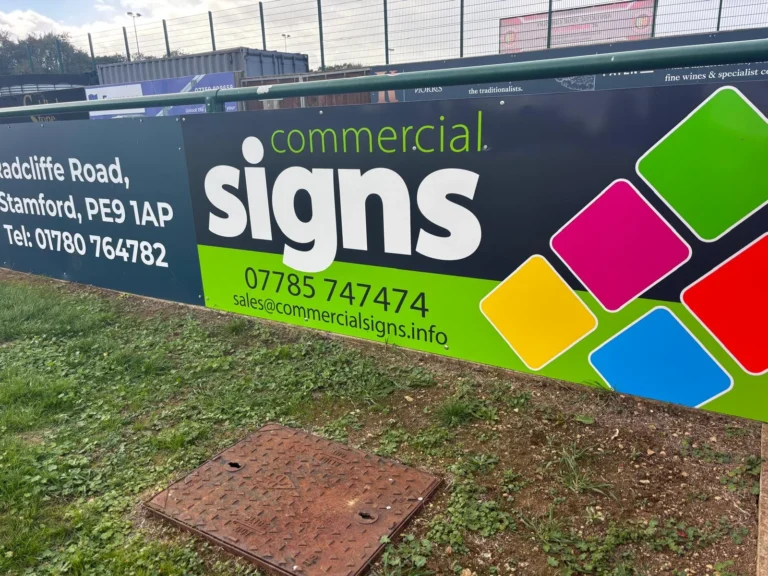 Commercial Signs branded pitchside sponsorship board at Stamford AFC football stadium