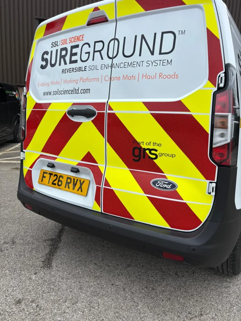 Sureground van rear branding surrounded by red and yellow chevrons